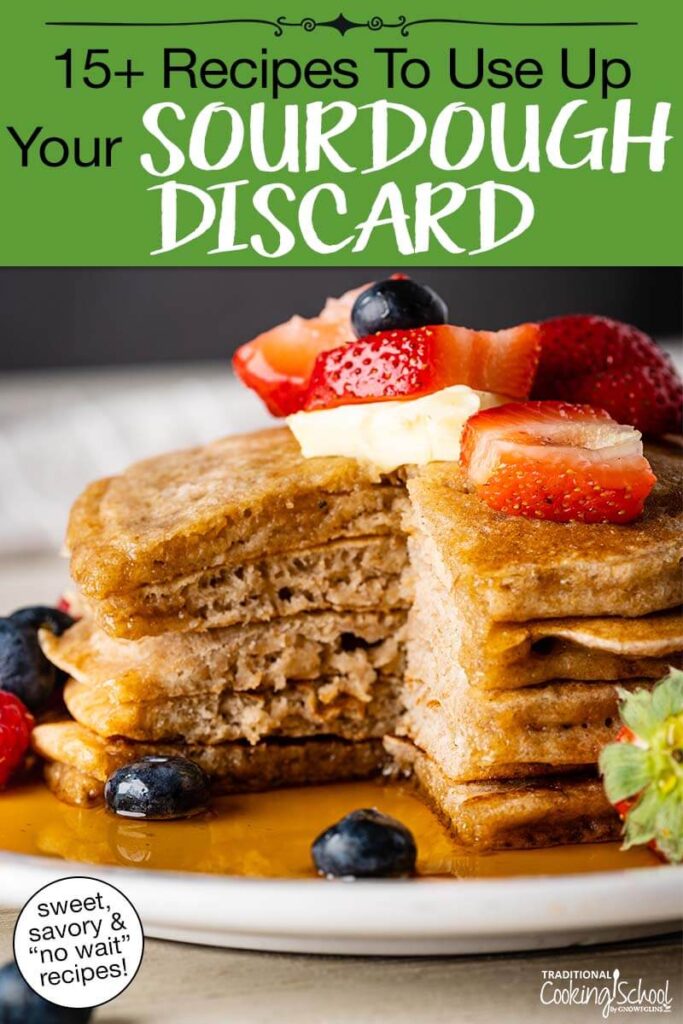 Stack of sourdough pancakes on a plate topped with butter, fresh berries, and maple syrup. Text overlay says: "15+ Recipes to Use Up Your Sourdough Discard (sweet, savory & "no wait" recipes!)"
