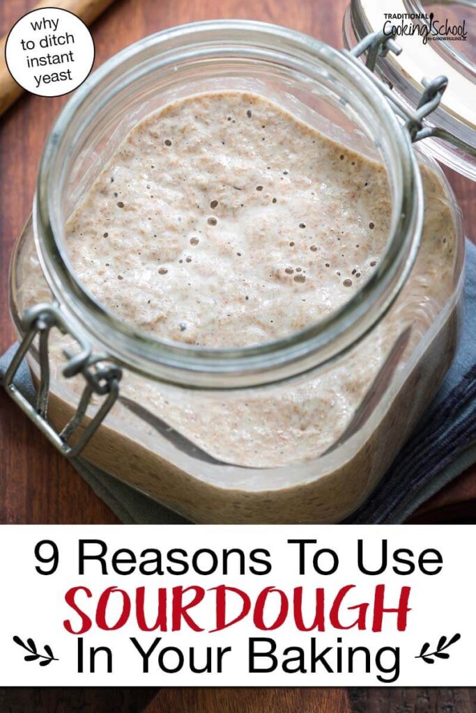 Bubbly sourdough starter in a large glass jar. Text overlay says: "9 Reasons To Use Sourdough In Your Baking (why to ditch instant yeast)"