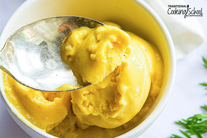 Spoonful of mango turmeric ice cream.