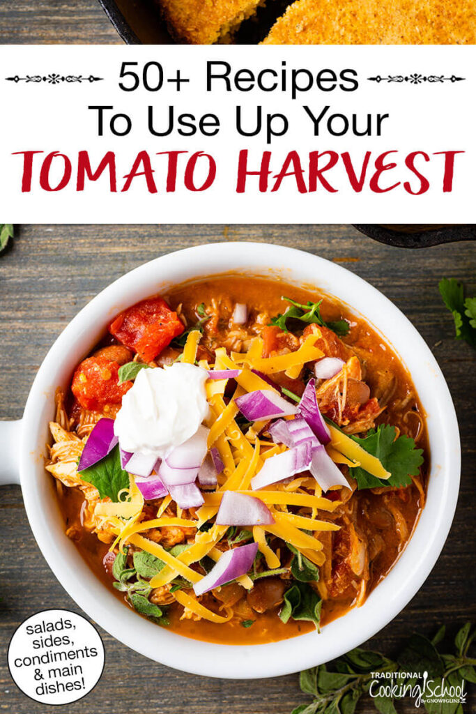 Overhead photo of a bowl of chili garnished with sour cream, red onion, grated cheese, and fresh herbs. Text overlay says: "50+ Tomato Recipes To Use Up Your Tomato Harvest (salads, sides, condiments & main dishes)"