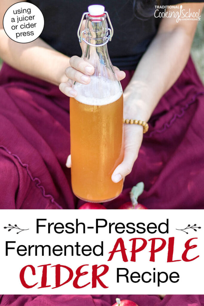 Woman holding up a swing-top glass bottle filled with foamy apple cider. Text overlay says: "Fresh-Pressed Fermented Apple Cider Recipe (using a juicer or cider press!)"