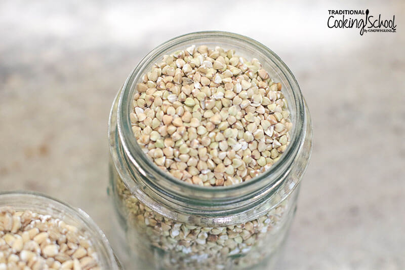 Close up photo of buckwheat, an ancient grain, in a mason jar.